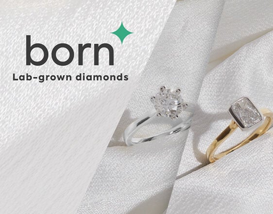 Woman wearing Born lab-grown diamond engagement rings and earrings, sustainable fine jewellery collection